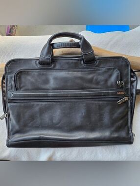 Tumi black leather briefcase